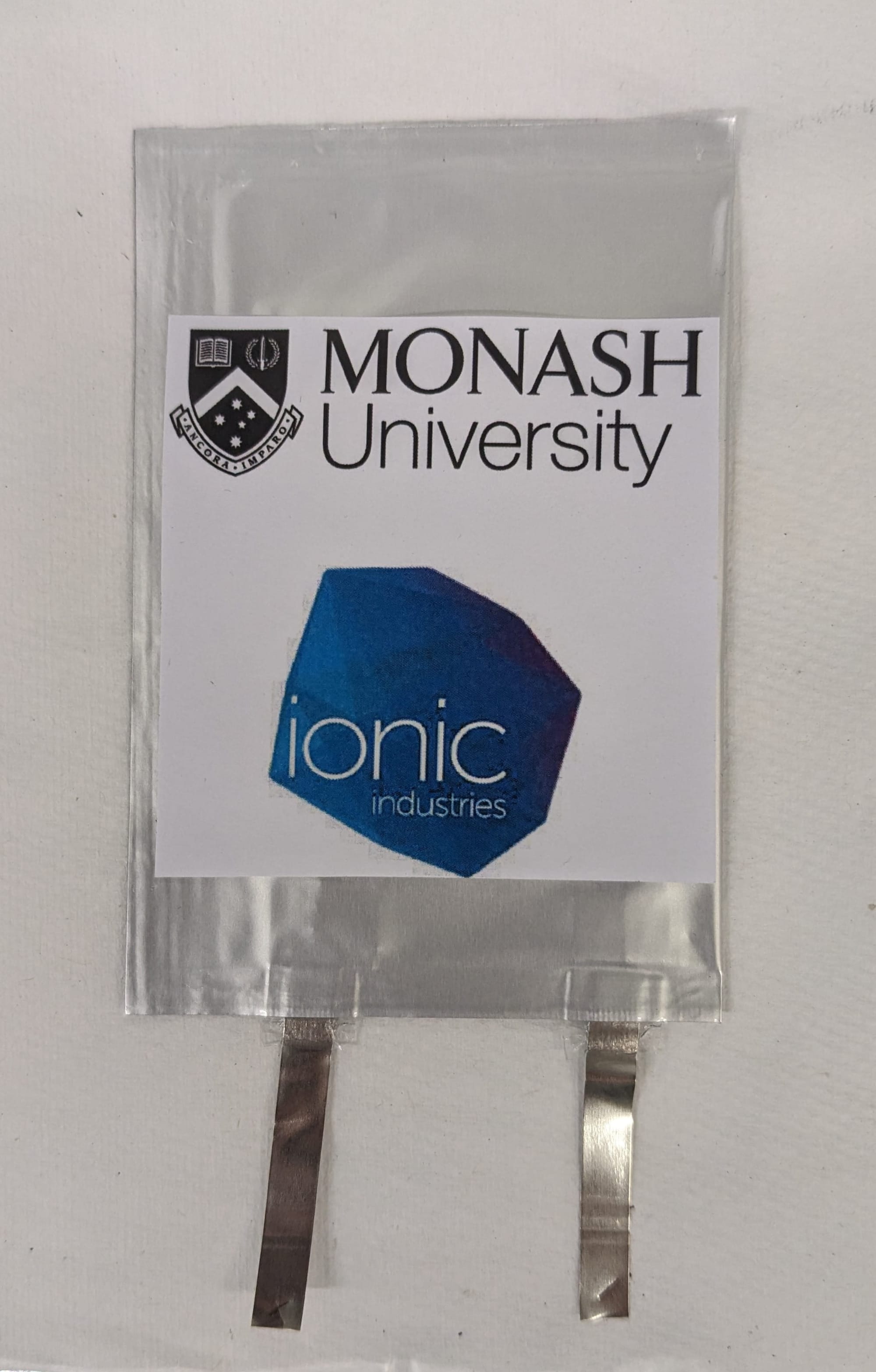 A prototype capacitor branded with 'Monash University' and 'ionic industries 