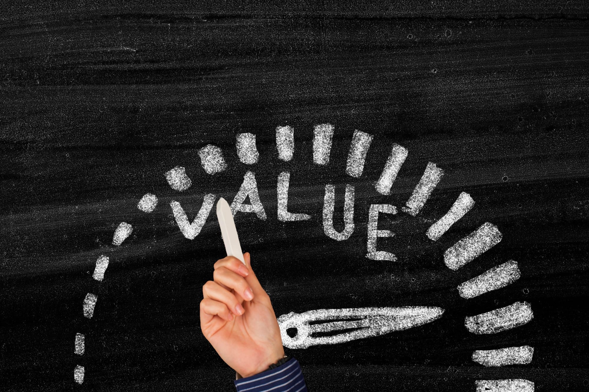 Speedometer on a blackboard measuring 'value'.