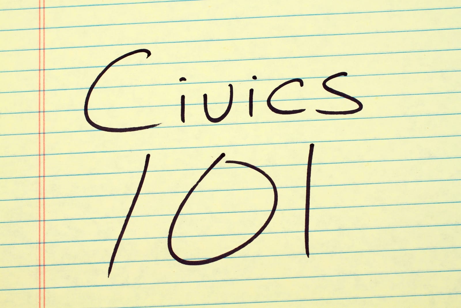 The words "Civics 101" on a yellow legal pad.